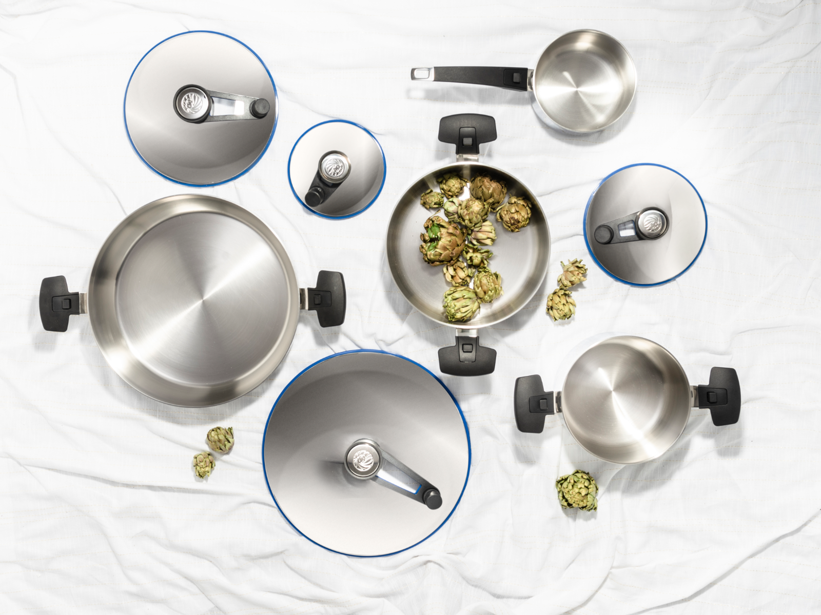 A family gathered around a dining table, enjoying a meal prepared in Royal Prestige cookware. The food is beautifully presented, with vibrant colors and appetizing aromas. The scene conveys a sense of warmth, togetherness, and the lasting enjoyment of Royal Prestige products.